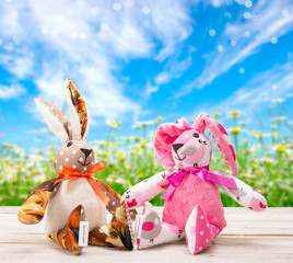 Two Easter bunnies and empty space for text. Easter holiday concept.