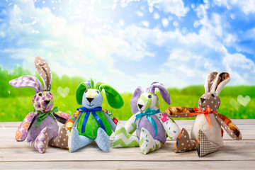 Four Easter bunnies and empty space for text. Easter holiday concept.