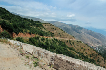 Fototapeta na wymiar Dangerous road in the mountains of Armenia and a big valley