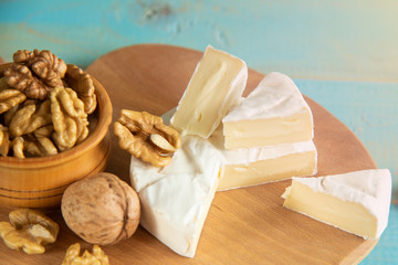 Fototapeta na wymiar Cheese camembert or brie with walnut kernels