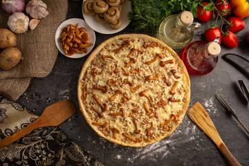 Mushroom pizza with marinated champignons and honey agarics.