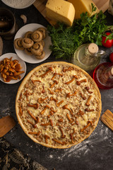 Mushroom pizza with marinated champignons and honey agarics.