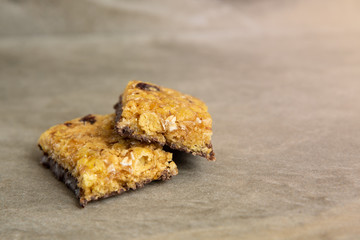 Muesli and cereal bar on marble stone background
