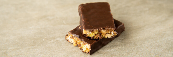 Muesli and cereal bar on marble stone background