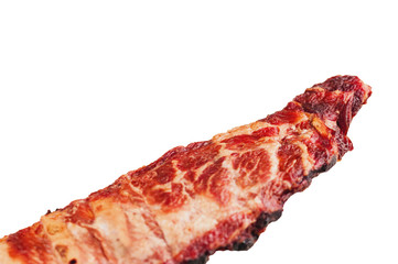 Big piece of smoked pork ribs isolated on white background without shadow