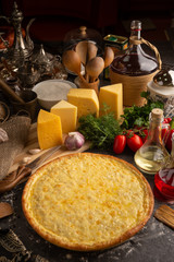 Pizza of four sorts of cheese for a restaurant menu.