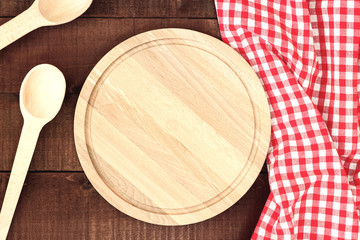 Cutting board or chopping board on wooden table.