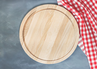 Cutting board or chopping board on wooden table.