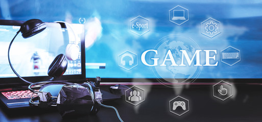 gamer workspace concept, game mechanism, mouse, keyboard headset, webcam, VR headset. Devices for cyber sport, e-sport on a black background table with digital symbols and text game. © shintartanya