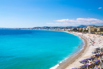 Nice, beautiful beach, French Riviera, Cote d'Azur or Coast of Azure. Bright turquoise water and public beach. 