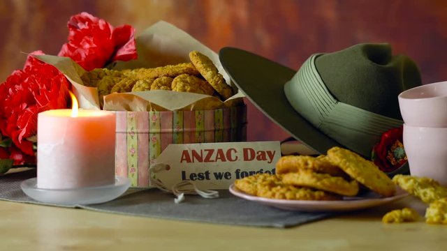 Traditional ANZAC biscuits for ANZAC Day and Remembrance Day memorial holidays in vintage style setting with Australian army slouch hat.