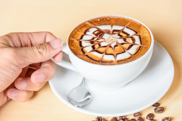 Take the hot cappuccino with nice milk pattern 