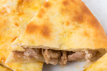 Delicious pie stuffed with lamb meat.