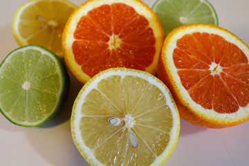 Citrus fruit halves. Lemons, limes and oranges