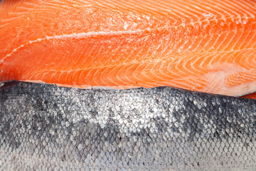 Closeup fresh norwegian salmon fillet fish on professional restaurant kitchen. Textured background....