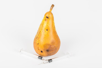Close up Boring trace of a codling moth Cydia Pomonella, in a wormy pear. On white background. With...
