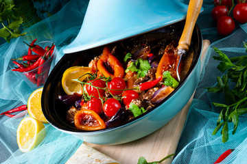 Tasty spicy beef with various vegetables cooked in tagine