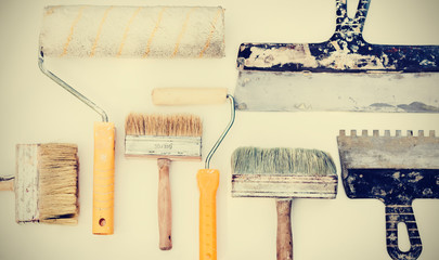 Wall paint brushes and imstruments for painting on the white background, well used with copy space for text.