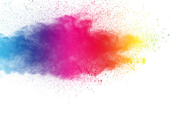 Colorful powder explosion on white background. Pastel color dust particle splashing.