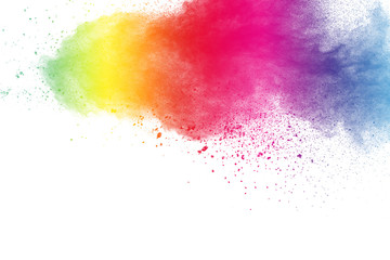 Colorful powder explosion on white background. Pastel color dust particle splashing.