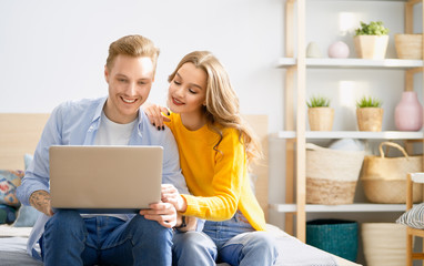 couple is using a laptop