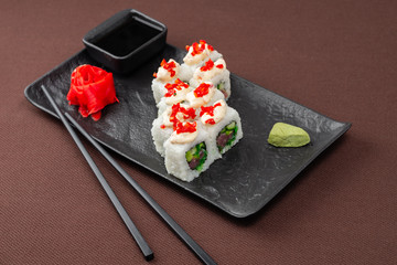 sushi on a black plate