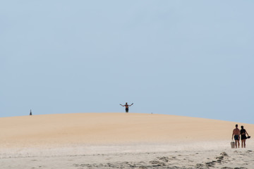minimalistic beach dune scene with real person 