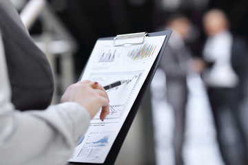 close up. business woman checking financial report