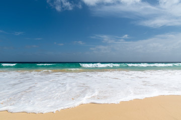 Fototapeta na wymiar calm waves on the beach 