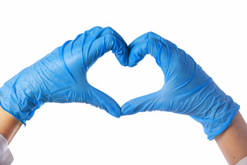 Close-up of hands in latex gloves. The heart is folded from the hands. Valentine card