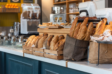 variety of bread on a stand of a bakery