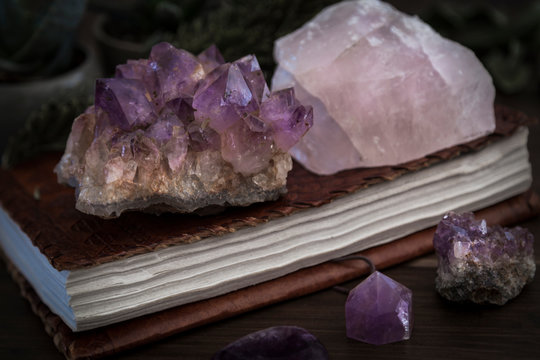 Closed Notebook or Journal with Amethyst and Rose Quartz Crystals on top