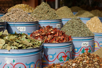 Selection of colourful herbs, spices, soaps and other craft products being sold in the souks of the Medina of Marrakesh (Marrakesh, Morocco, Africa)