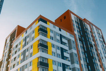 Fototapeta premium Parts of the facades of modern houses. Bright juicy colors in the construction of buildings.