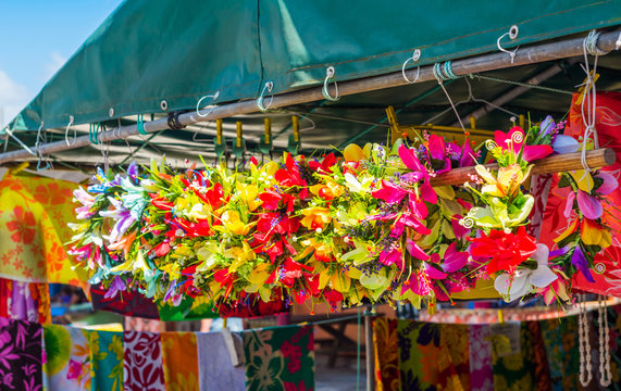 Flower wreaths on the local market, Rarotonga, Aitutaki, Cook Islands. With selective focus.