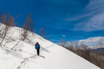 A man in mountain day winter