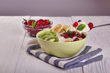 porridge with fruit on wooden background