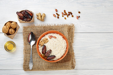 porridge with fruit on wooden background