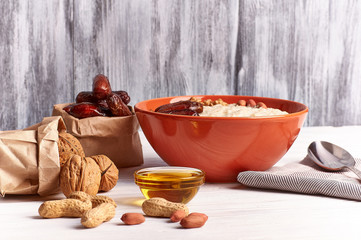 porridge with fruit on wooden background