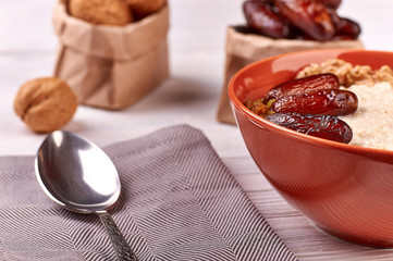 porridge with fruit on wooden background