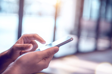 Close up of woman hands using mobile smartphone at home, She searching or social networks concept. copy space.