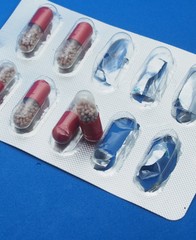 The drug in capsules. Capsules lie in plastic transparent packaging.