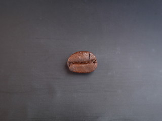 A coffee bean on black background
