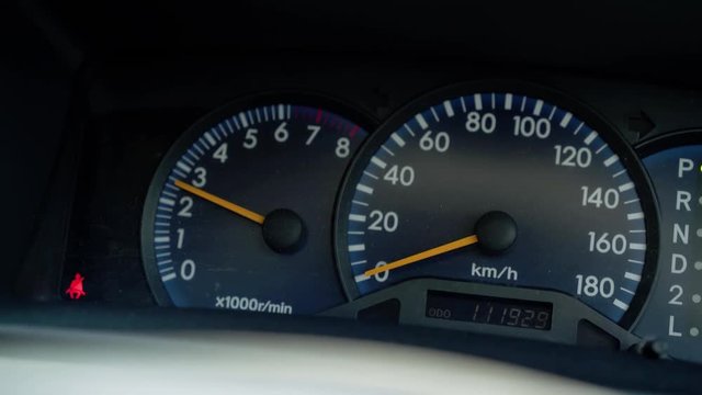 Car dashboard. Working speedometer, tachometer, belt buckle indicator Close up