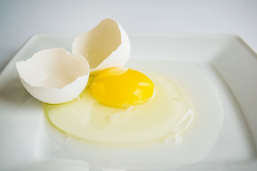 broken egg on a plate