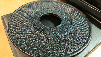 Metal cast iron stand for hot dishes in shop