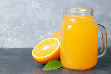 Obraz na płótnie Canvas glass jar of fresh orange