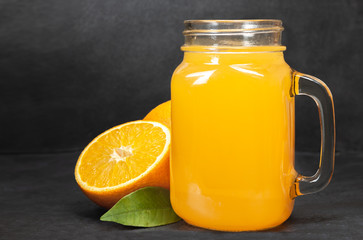 Obraz na płótnie Canvas glass jar of fresh orange