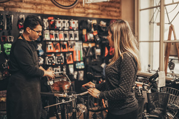 Young woman in bicycle shop.
