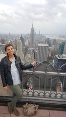 Fototapeta na wymiar hot sexy breathtaking woman on top of rockefeller center new york